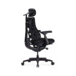Black ergonomic office chair with a high back, headrest, and adjustable armrests on a wheeled four-star base (side view).